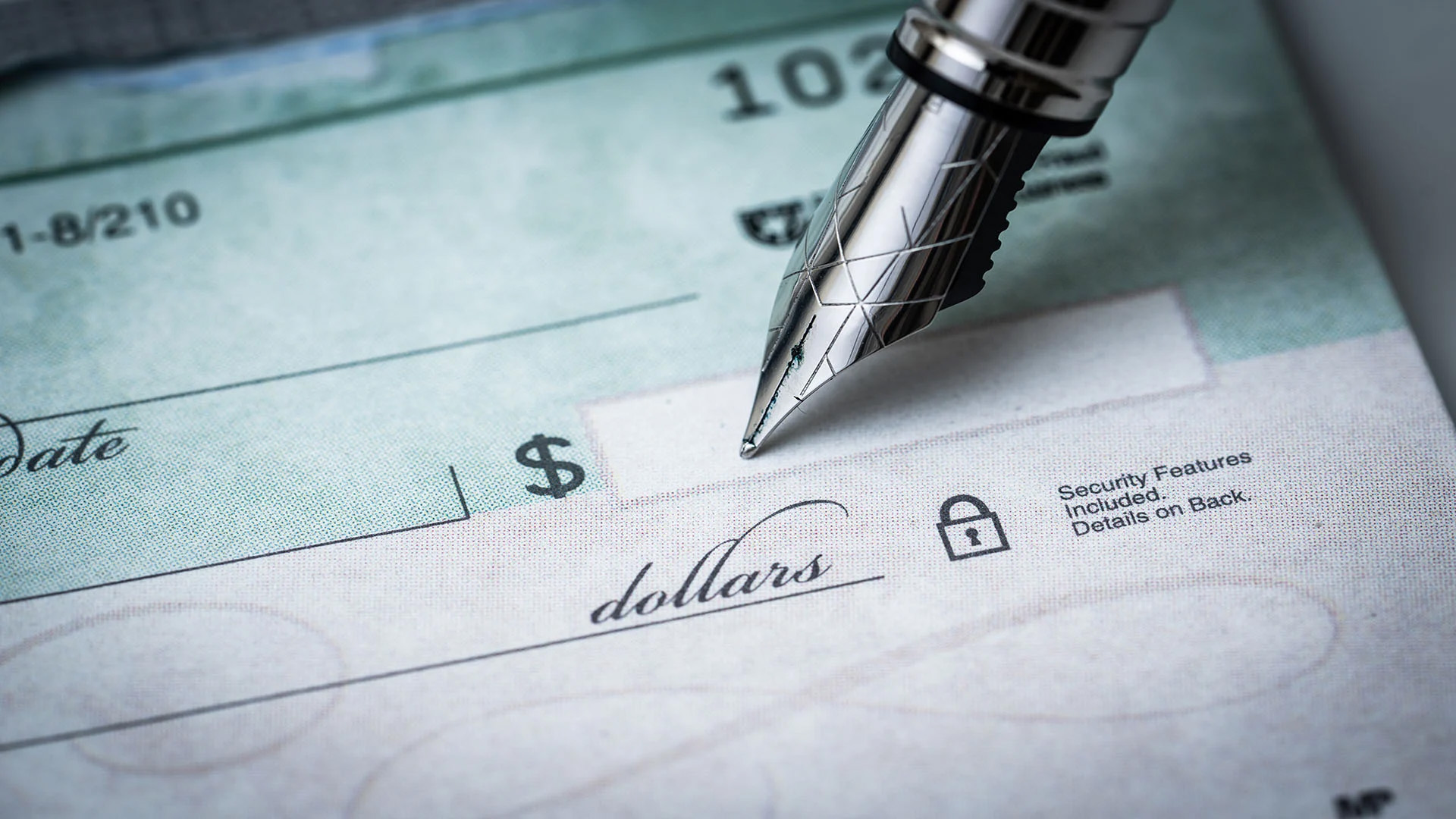 pen tip on a blank check