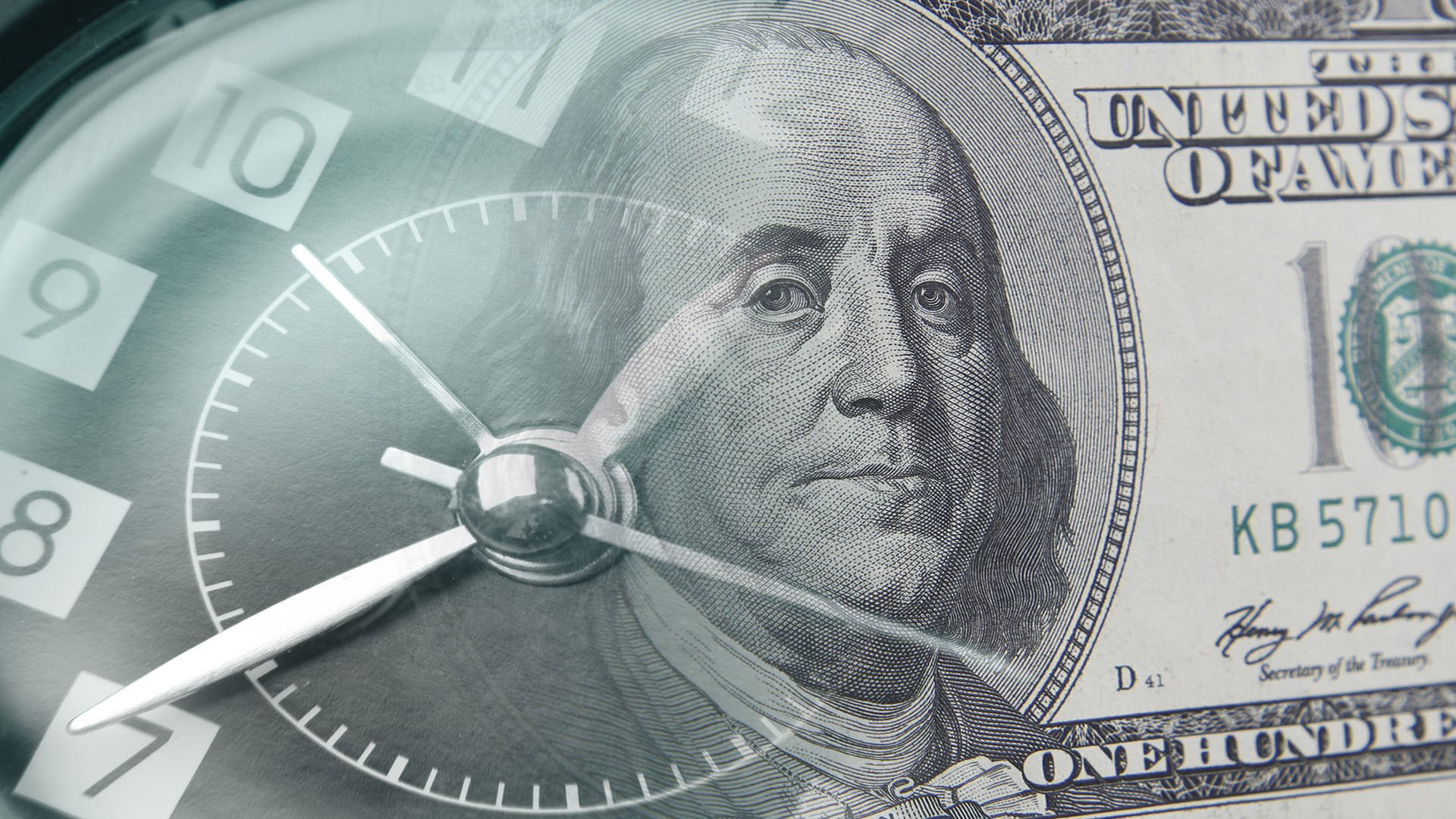 close up of American Currency and digital clock